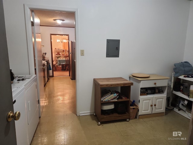 hall featuring electric panel and washer and dryer