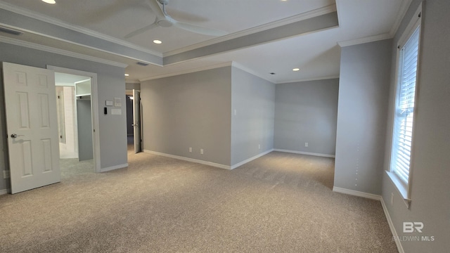 empty room featuring light carpet, ceiling fan, and crown molding