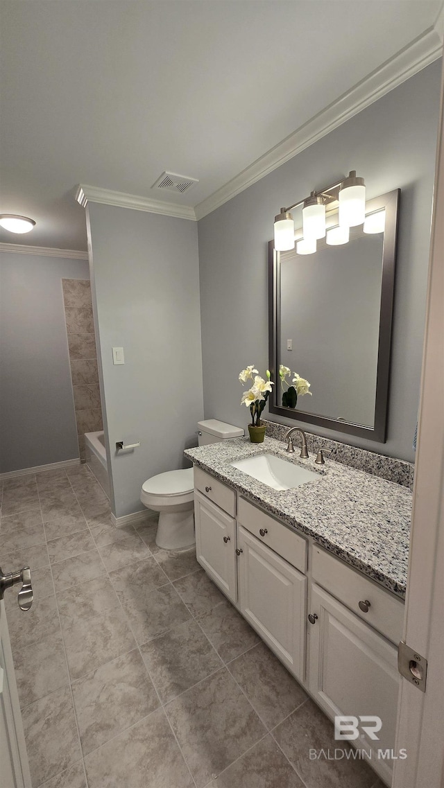 bathroom featuring crown molding, vanity, and toilet