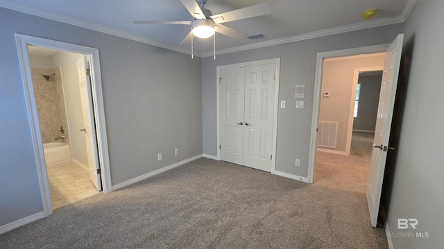 unfurnished bedroom with light carpet, ensuite bathroom, ceiling fan, and ornamental molding