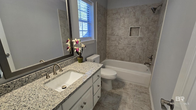 full bathroom with vanity, tiled shower / bath combo, and toilet