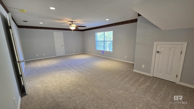 spare room featuring carpet floors and ceiling fan