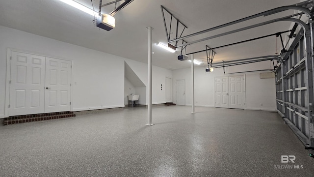 garage featuring a garage door opener and sink