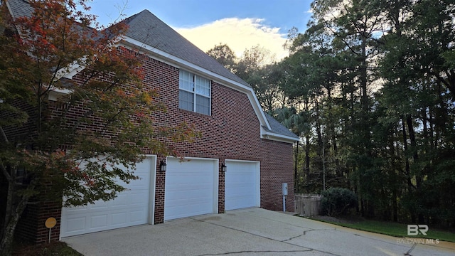 property exterior at dusk with a garage