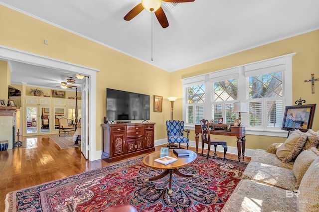 living room with hardwood / wood-style floors and ceiling fan