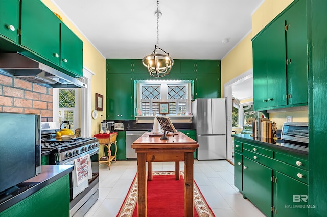 kitchen featuring light tile patterned flooring, appliances with stainless steel finishes, a chandelier, and green cabinets