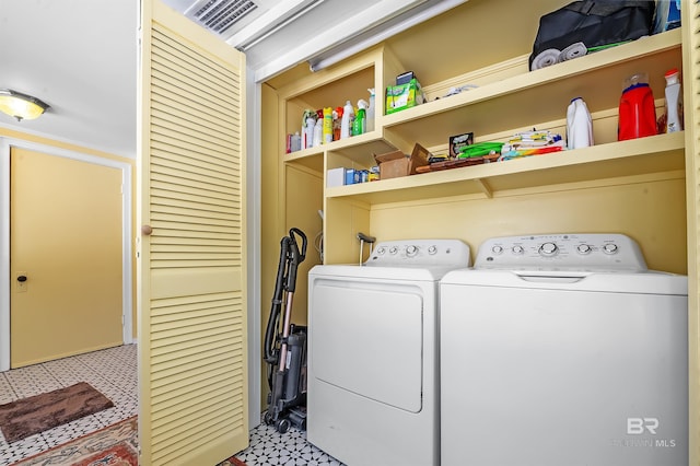 clothes washing area with independent washer and dryer