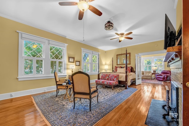 bedroom featuring hardwood / wood-style flooring and crown molding