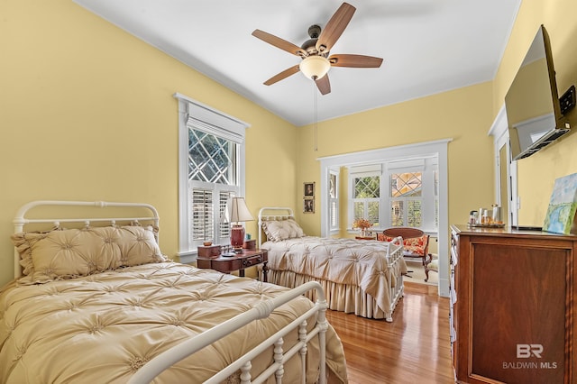 bedroom featuring light wood-type flooring and ceiling fan