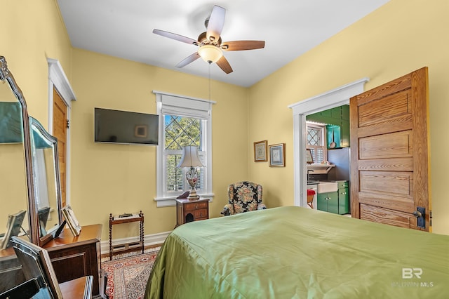 bedroom with wood-type flooring and ceiling fan