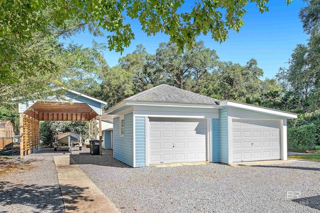 garage featuring a carport