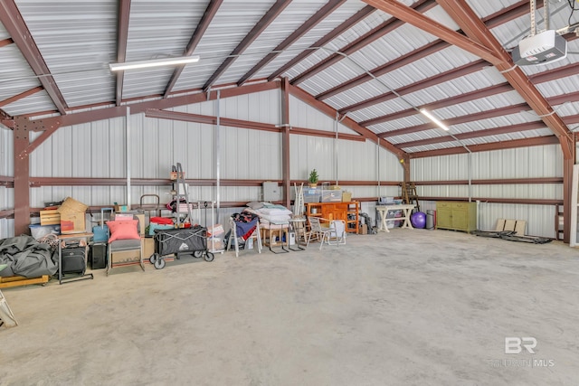 garage with a garage door opener and metal wall