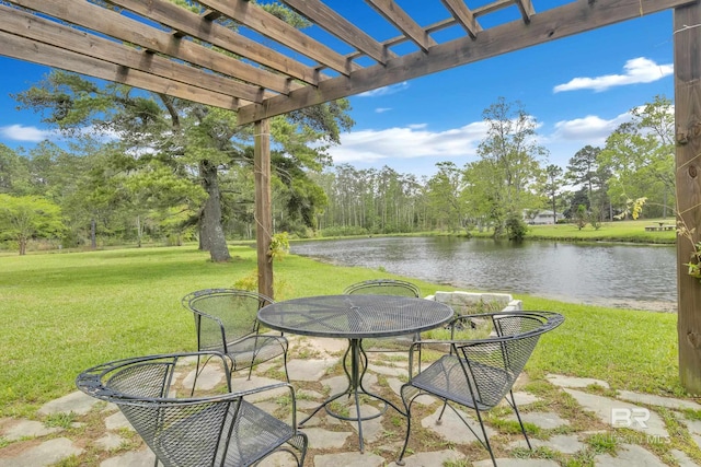view of patio with a water view and a pergola