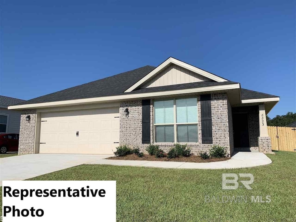 view of front facade featuring a front yard and a garage