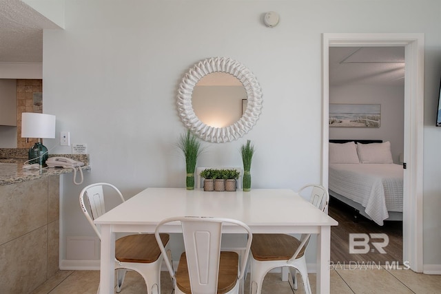 dining area with light tile patterned floors