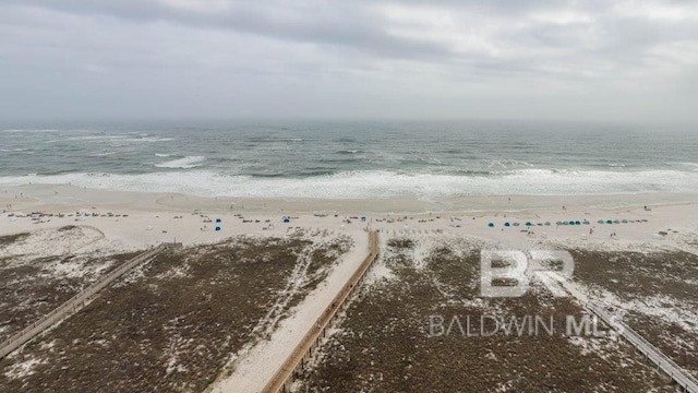 birds eye view of property with a view of the beach and a water view