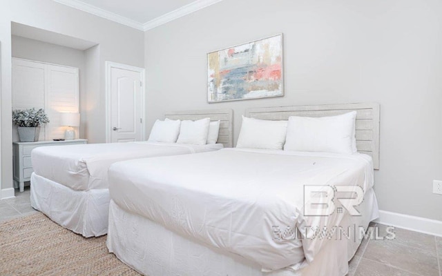 bedroom featuring light tile patterned floors, ornamental molding, and baseboards