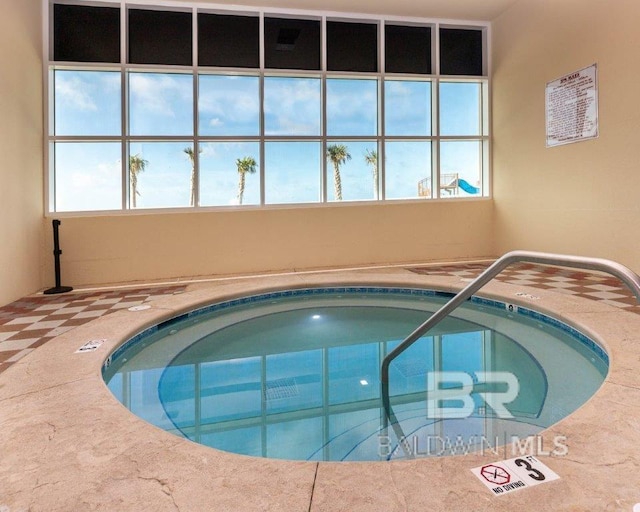 view of pool featuring an indoor hot tub