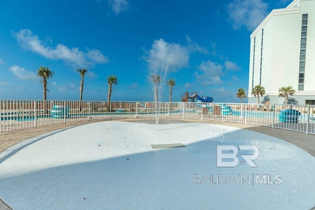 surrounding community featuring a pool, playground community, and fence