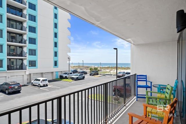 balcony featuring a water view