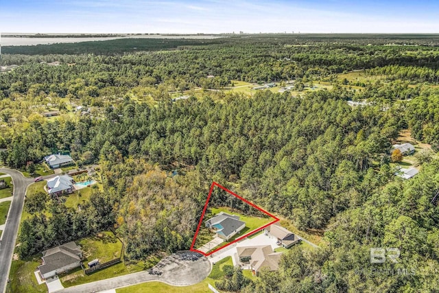 bird's eye view featuring a forest view