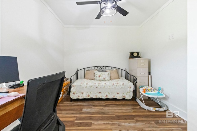 bedroom with crown molding, ceiling fan, and dark hardwood / wood-style floors