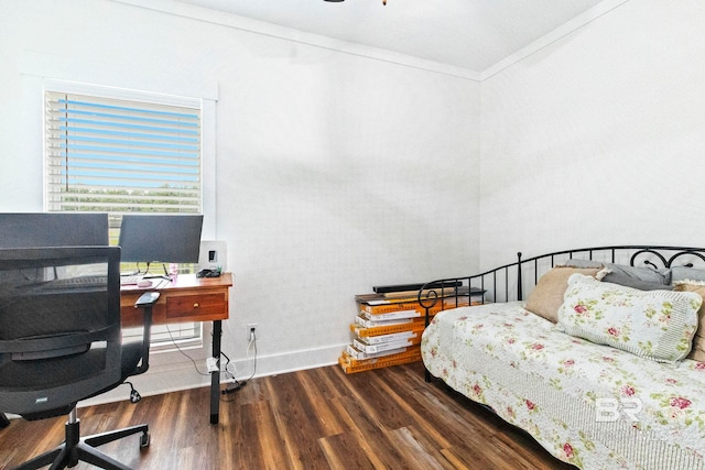 bedroom featuring crown molding and dark wood-type flooring