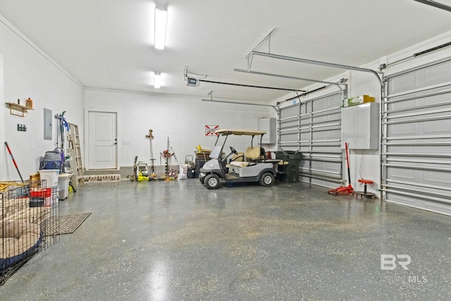 garage featuring a garage door opener and electric panel