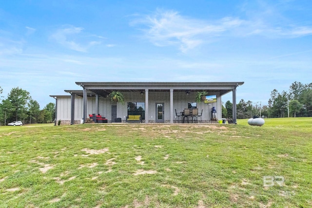 rear view of house with a yard