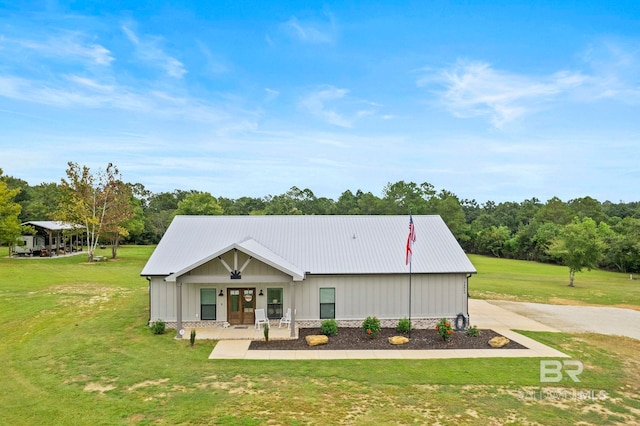 exterior space with a front lawn and covered porch