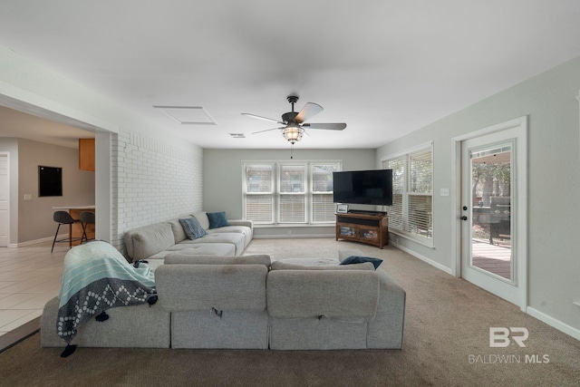 tiled living room with ceiling fan