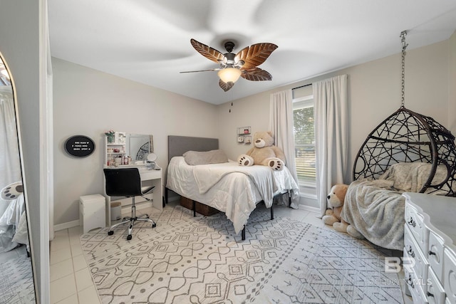 bedroom featuring light tile patterned floors and ceiling fan