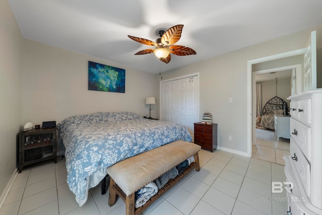 tiled bedroom featuring a closet and ceiling fan