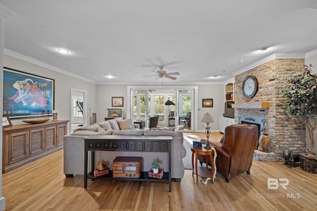 22649 Alice Ln, Fairhope, AL 36532 - living area with crown molding, a brick fireplace, and wood finished floors