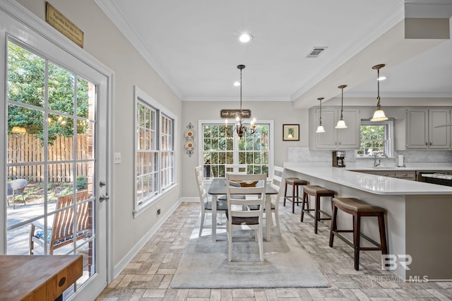 22649 Alice Ln, Fairhope, AL 36532 - dining room featuring baseboards, visible vents, recessed lighting, crown molding, and a chandelier