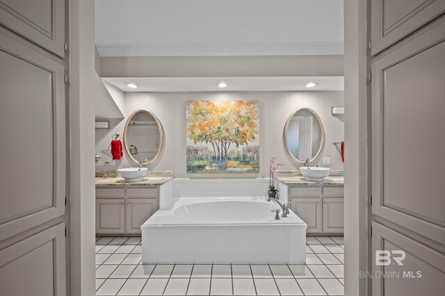 22649 Alice Ln, Fairhope, AL 36532 - bathroom with two vanities, tile patterned floors, a bath, and a sink