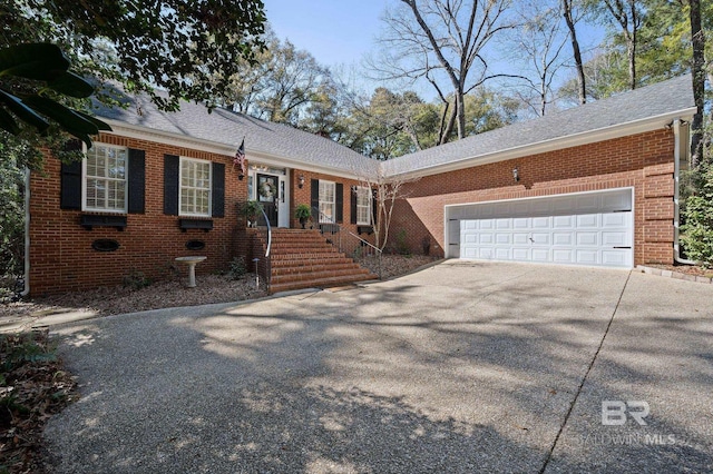 22649 Alice Ln, Fairhope, AL 36532 - ranch-style house featuring brick siding, an attached garage, driveway, and a shingled roof