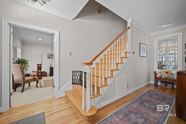 22649 Alice Ln, Fairhope, AL 36532 - stairway featuring crown molding, wood finished floors, and visible vents
