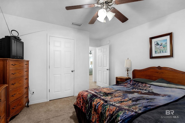 carpeted bedroom with ceiling fan