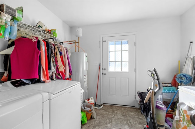 laundry room with separate washer and dryer and electric water heater