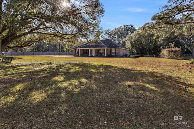 view of front of home with a front yard