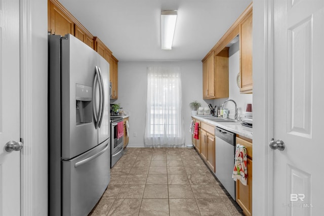 kitchen featuring sink, light brown cabinets, and appliances with stainless steel finishes