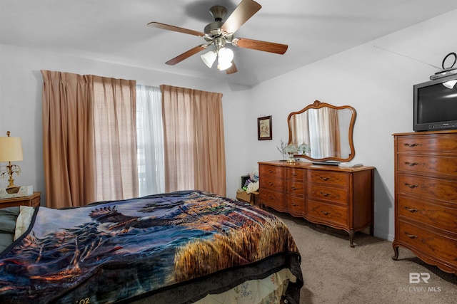 bedroom with ceiling fan and light colored carpet