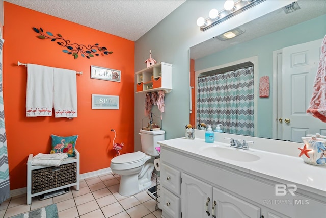 bathroom featuring tile patterned floors, toilet, curtained shower, a textured ceiling, and vanity