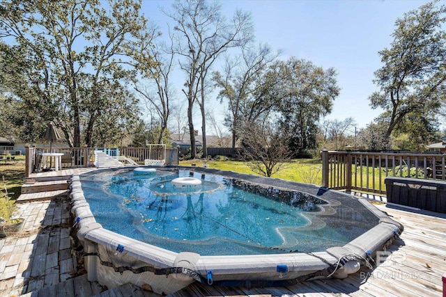 view of pool with a wooden deck