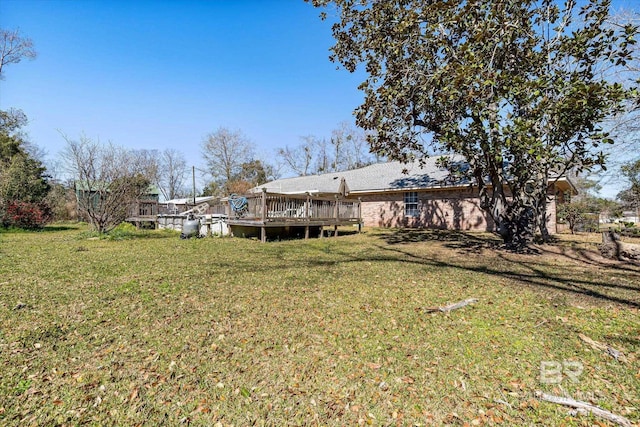 view of yard featuring a deck