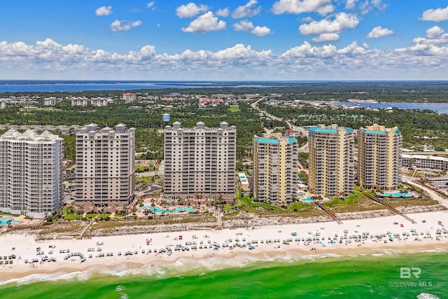 drone / aerial view featuring a view of the beach and a water view