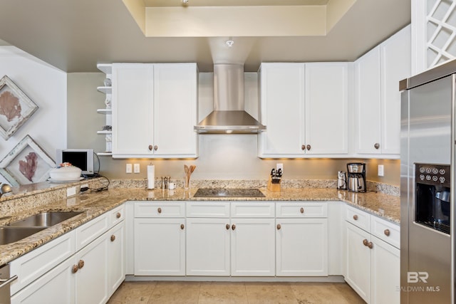 kitchen featuring white cabinetry, wall chimney exhaust hood, high end fridge, sink, and light tile floors