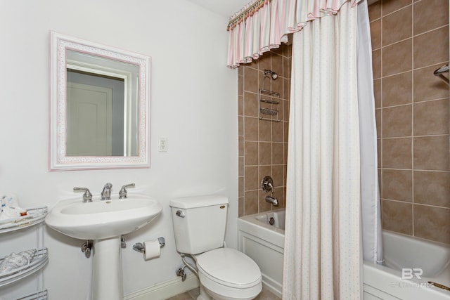 bathroom featuring toilet and shower / bath combo with shower curtain