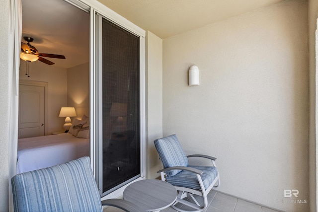 balcony featuring ceiling fan